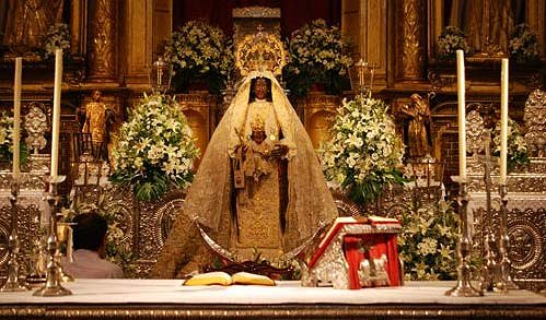 The Black Madonna placed behind the altar as if she was presiding at mass