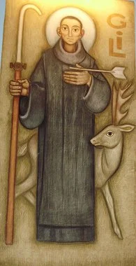 St. Gil and his only companion later in life: a deer whom he saved from hunters by intersepting their arrow with his body, which earned him the post of patron saint of cripples. A painting in the chapel of the Black Madonna.