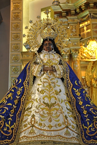 The "Vicar", i.e. religious substitute image of the Black Madonna of Antipolo. She is a copy that travels around, dispensing the graces of her mother-statue. Our Lady of Fatima has a similar pilgrim-statue, which travels the world. Photo by Ellis Manuel Mendez