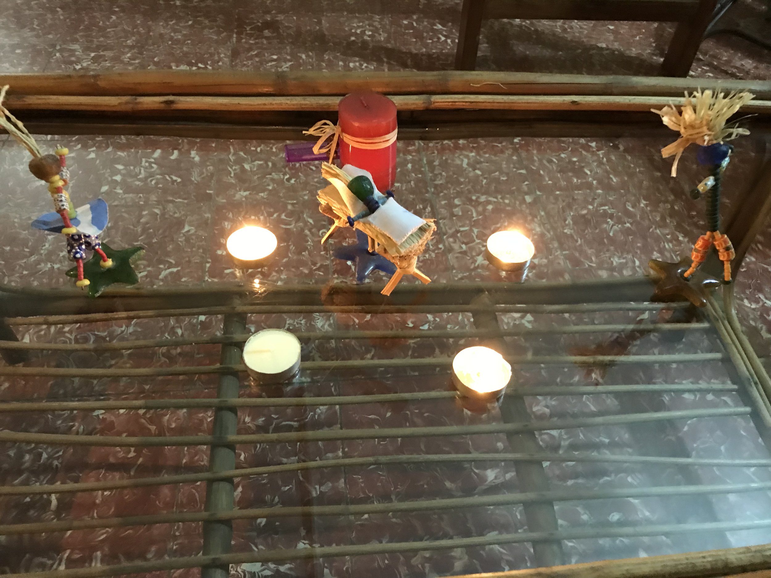  The altar at the Sierra Leone International Church. &nbsp;Three candles lit for the third Sunday in Advent. 