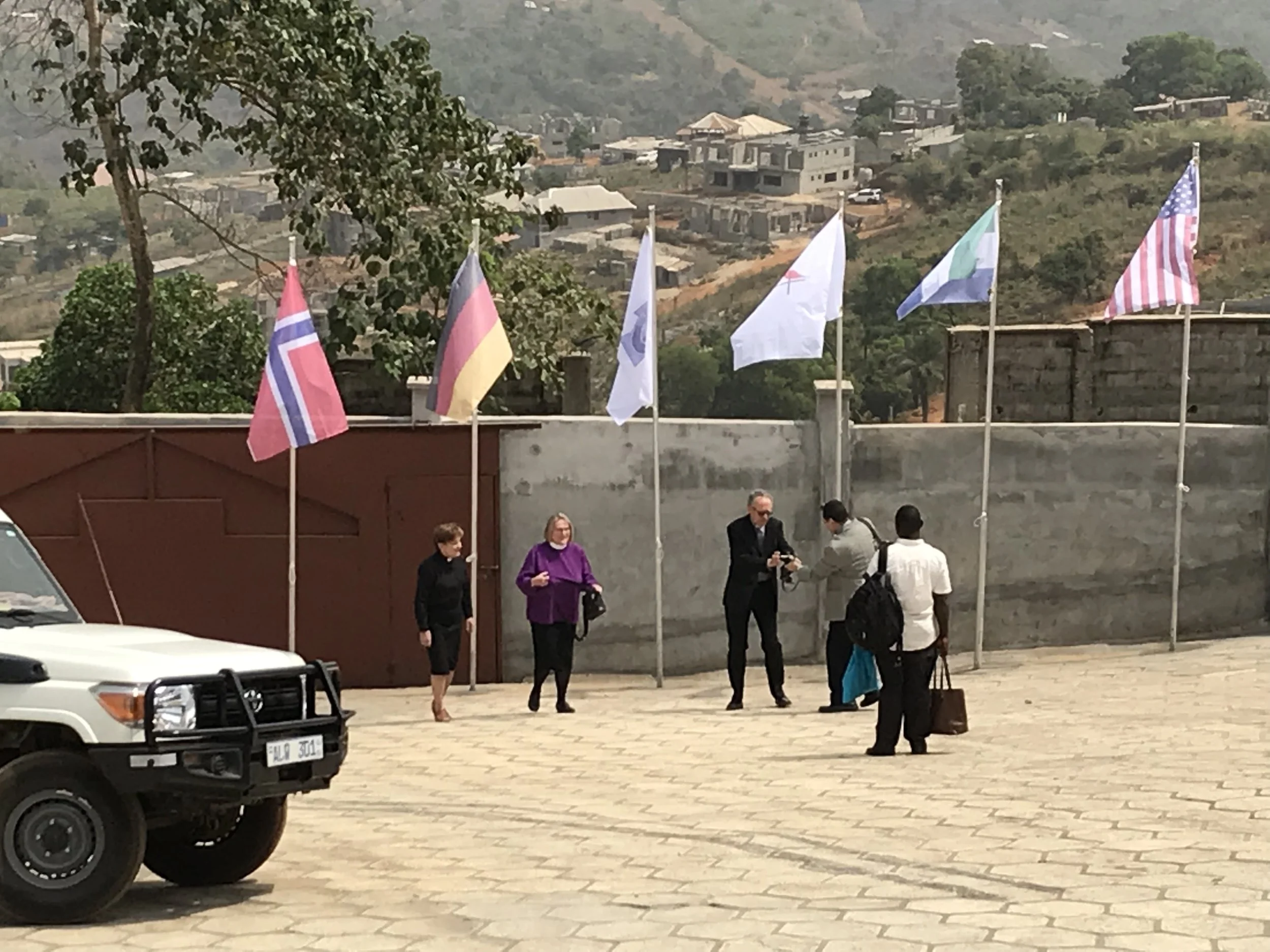 Our international guest's arrival. &nbsp;They wanted to take photos in front of the many international flags. 