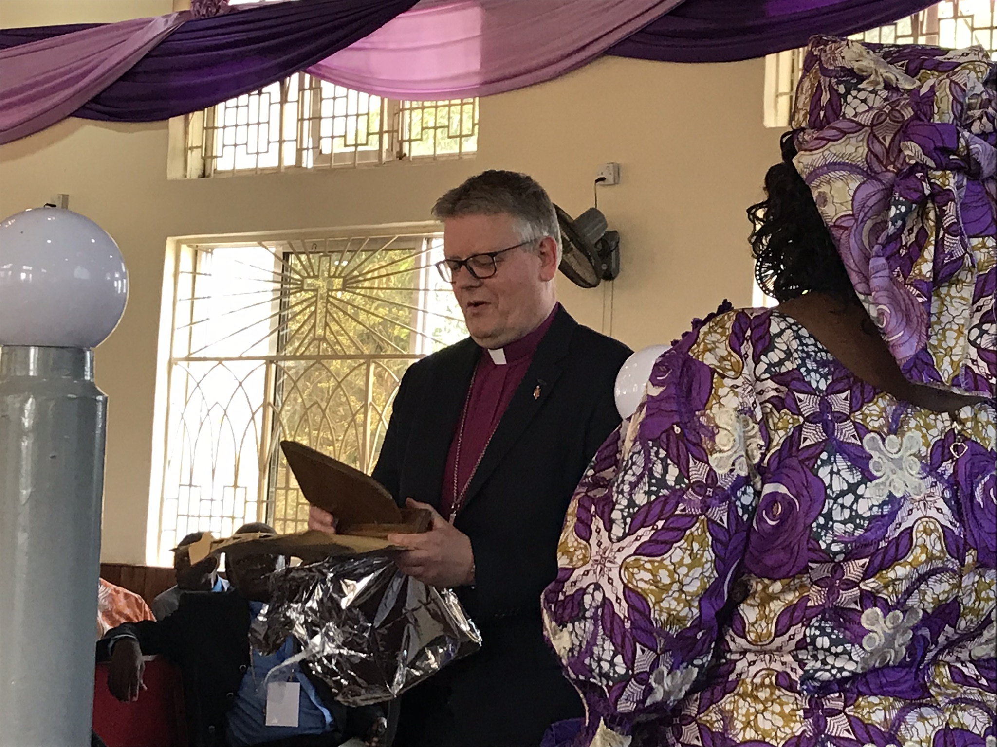 Presenting gifts to the international guests. This is Bishop Alstead from the Baltic Area in Europe. This is a generous gift-giving culture.
