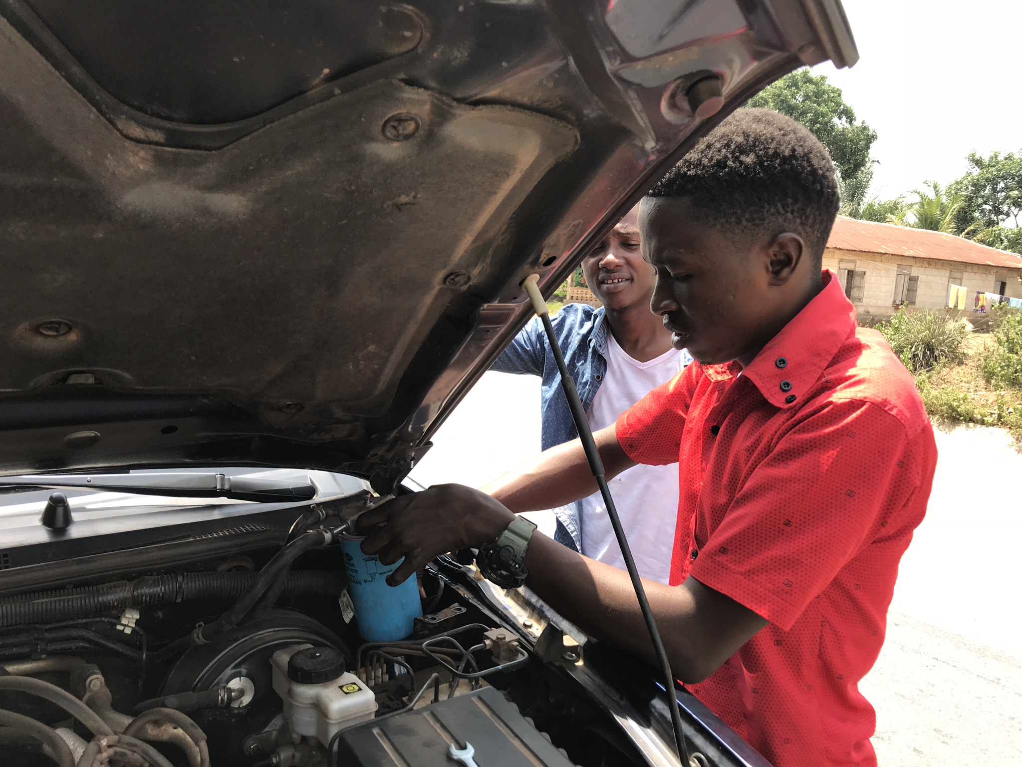  About two hours in, after we picked up a another student of mine in Makeni, the truck started giving us trouble.  My driver recognized it immediately as a fuel issue.  But we’d just had the fuel filter and all that entailed looked at.  We’d obviousl