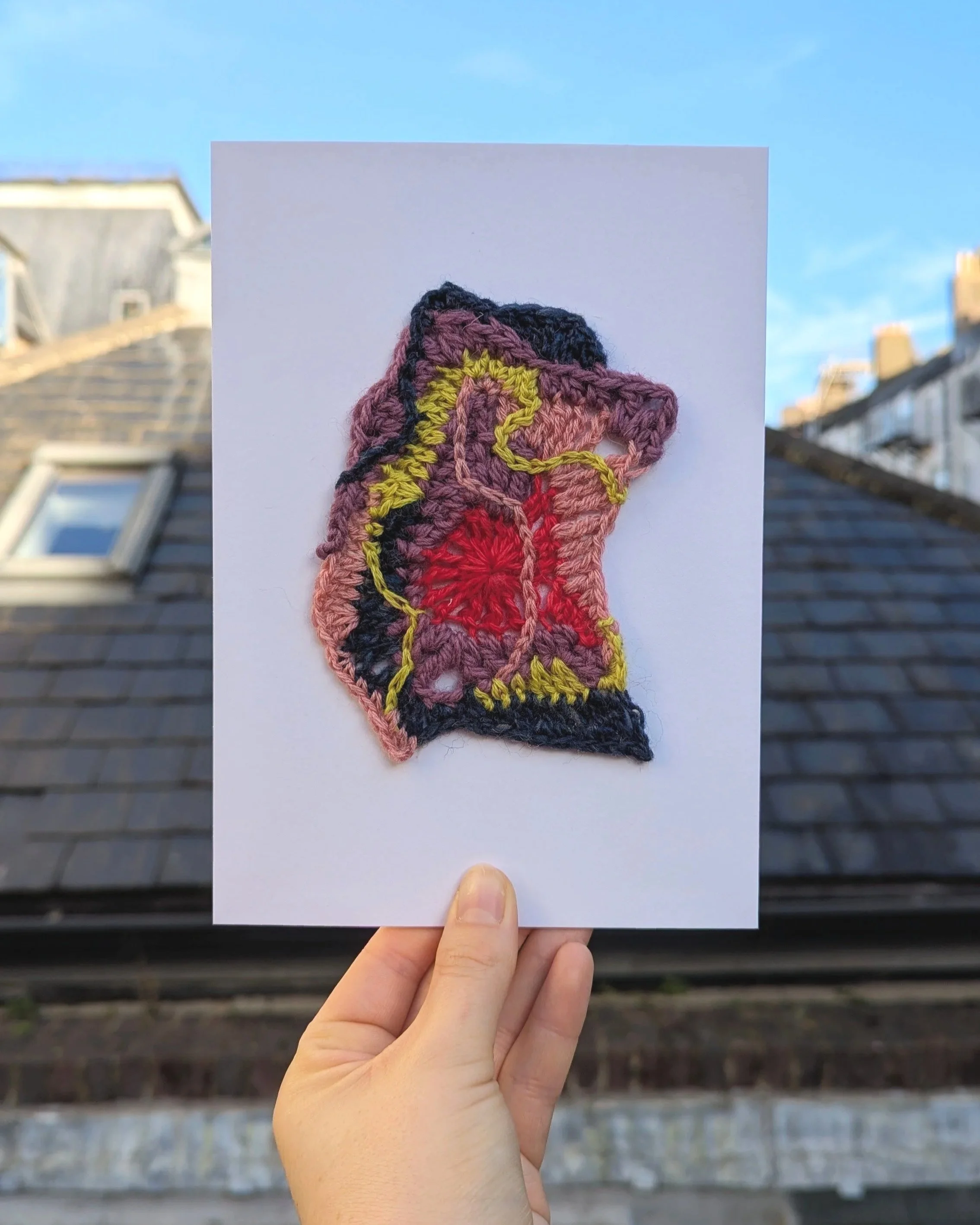 Altas+1_A5_Crochet_Textile_Artwork_Cathy+Van+Hear_.jpg Crochet artwork map-like forms in red, pink, yellow, and dark blue.