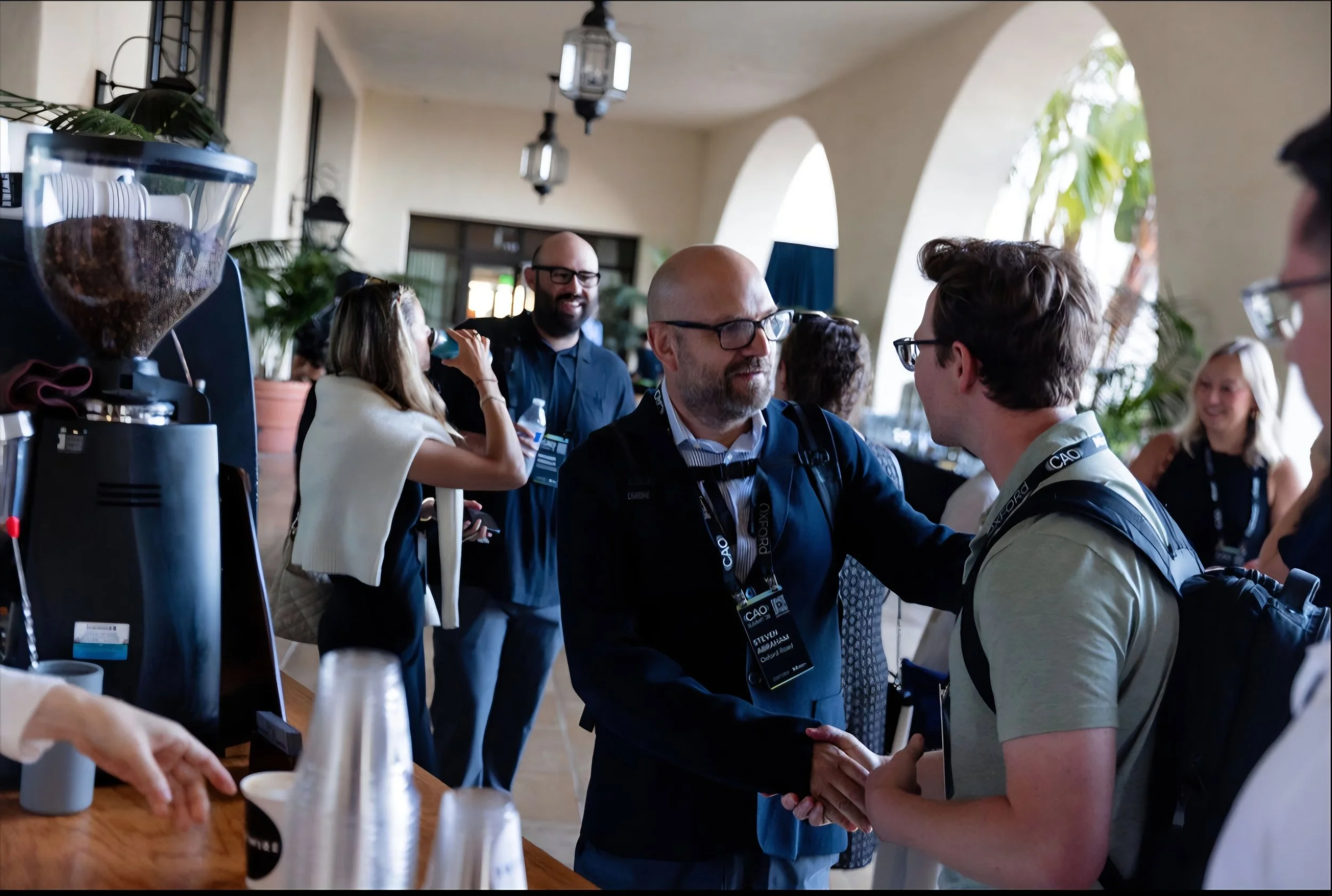 Corporate guests networking around a Rugged Coffee espresso bar