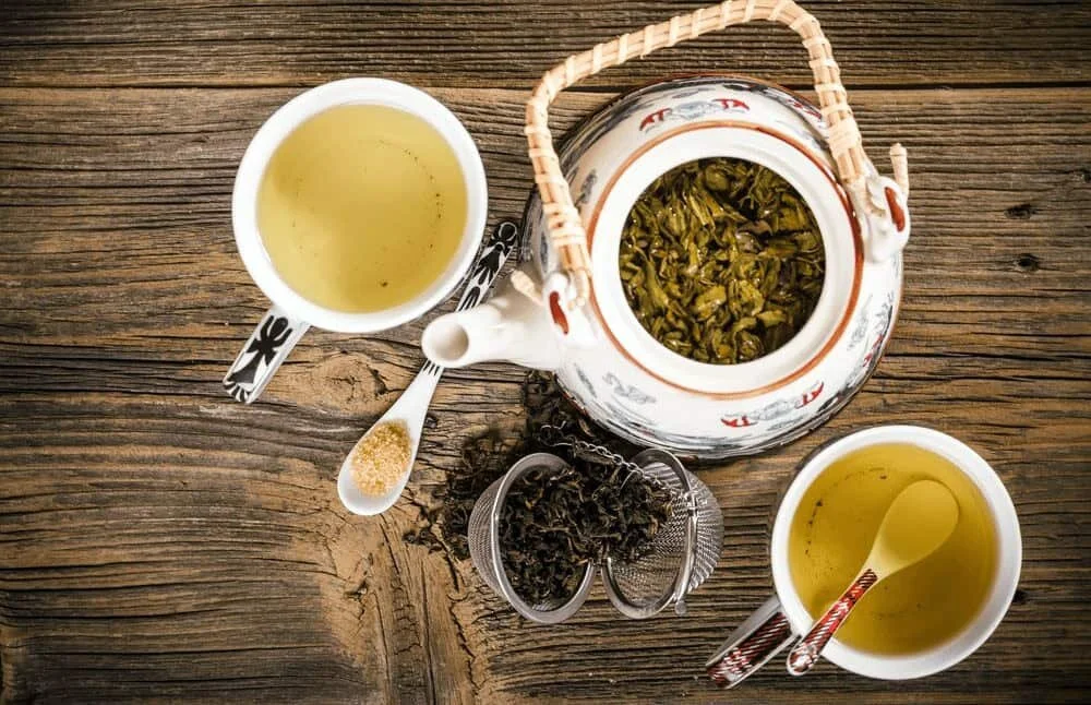 tea pot with white and green tea