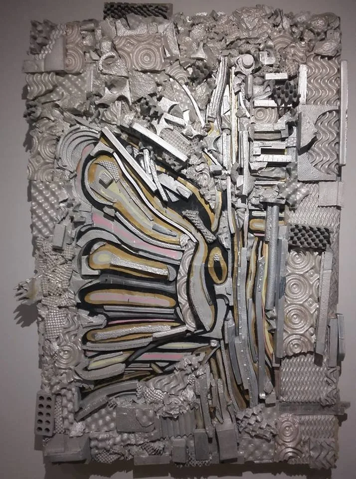 Textured mixed-material assemblage sculpture by Calvin Brett for a commercial interior