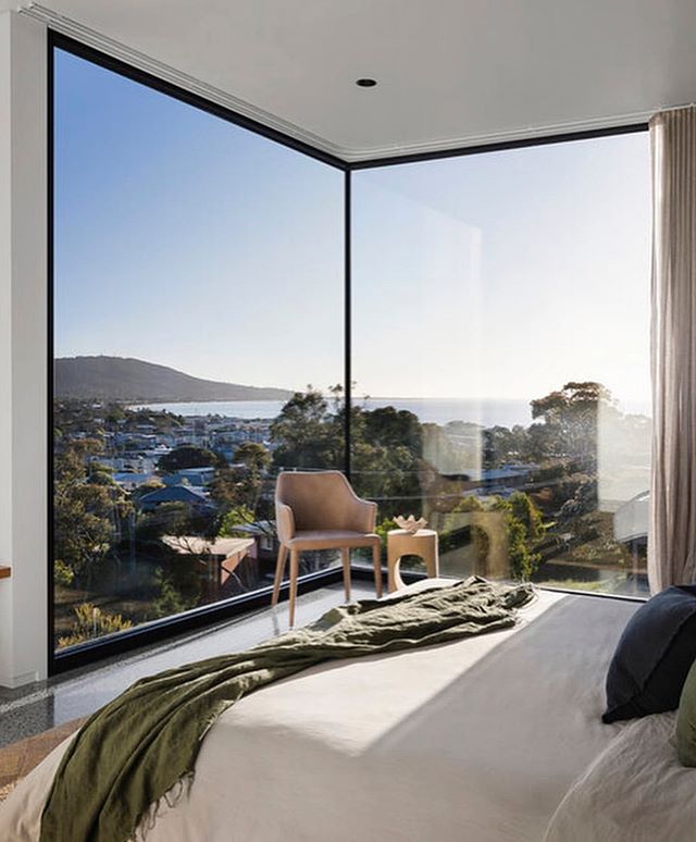 We love these corner windows. Extremely modern and it opens up the space!