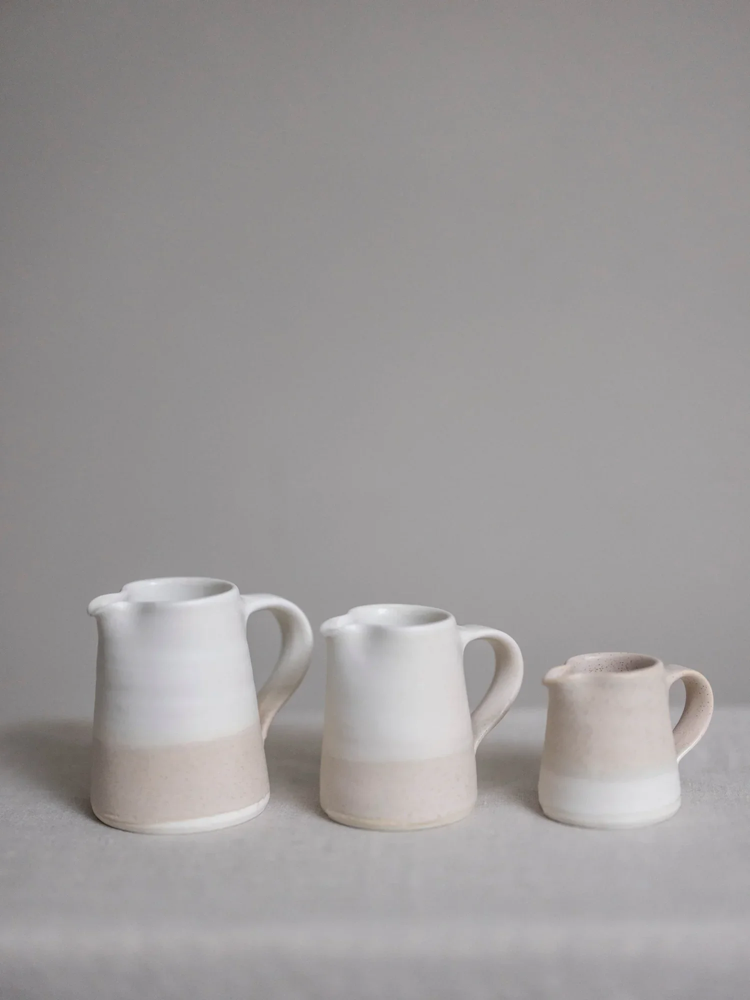 Set of White Clevedon Jugs