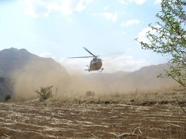 Defense force helicopter landing at Pulane Children's Centre 