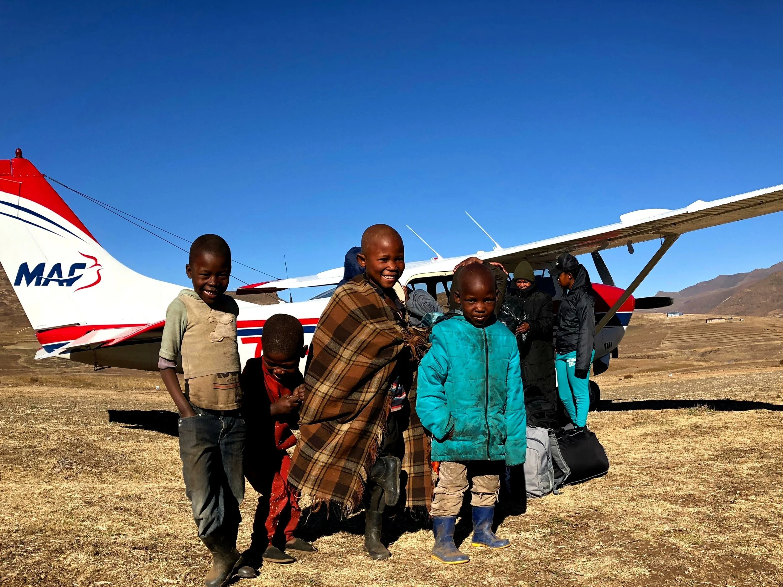 People are always excited to see the planes arrive to their village. One place in particular, I always notice a group of kids standing in the same spot when I taxi past for take-off. They are always waving and smiling. On one flight in June I stopped the plane near their hut (the huts are about 10 meters away from the runway) to offload. They were very excited to get closer and see what the plane looked like inside!