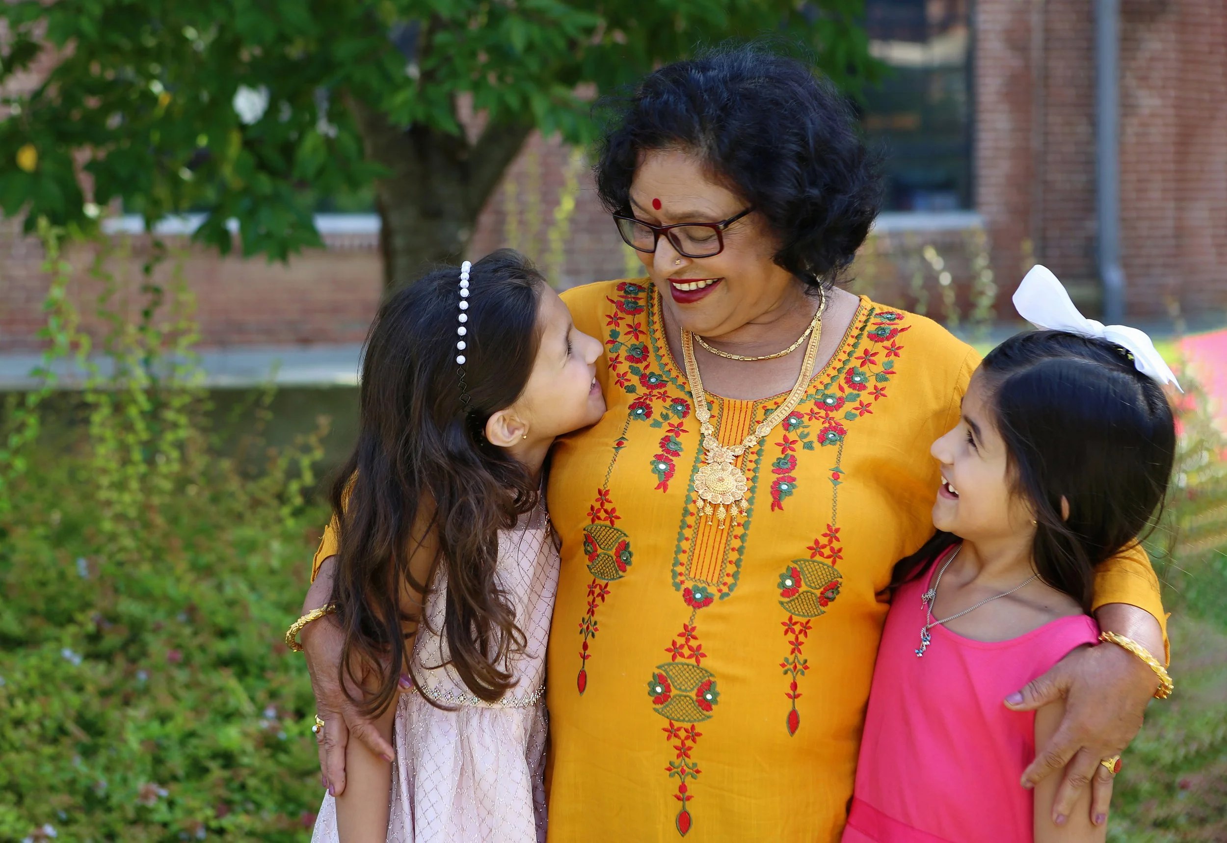 family portrait of two boys running by Rachel Garrison