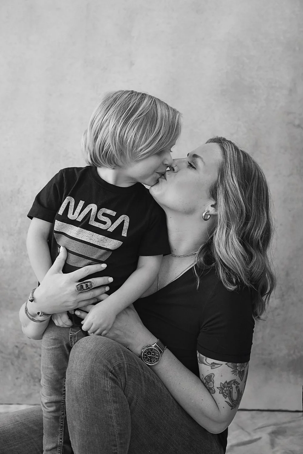 family portrait in black and white of mom and two sons
