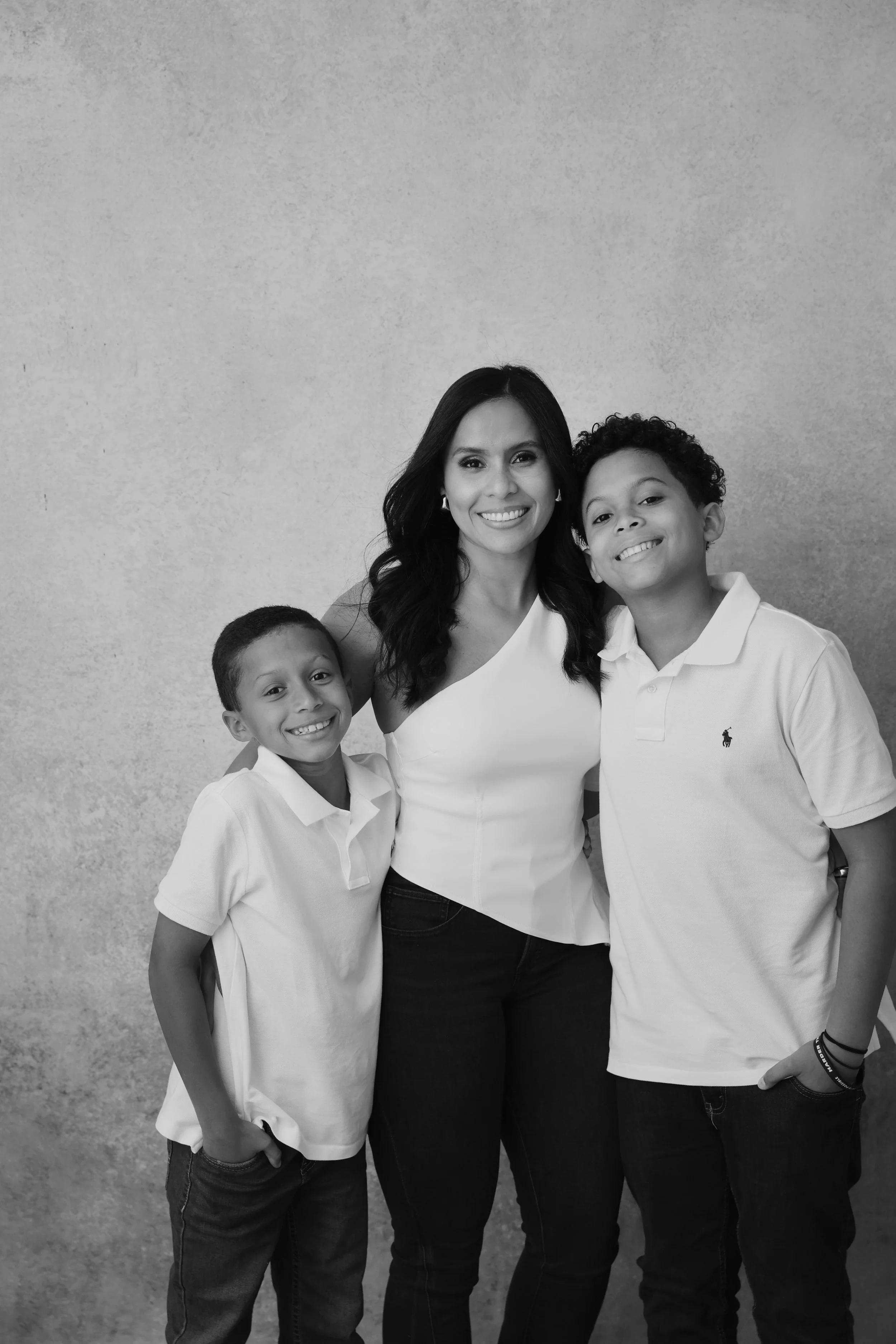 family portrait in black and white of mom and two sons