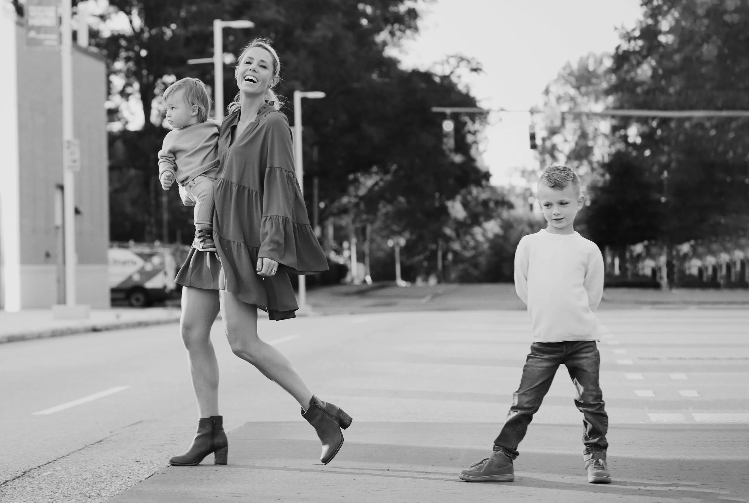 family portrait of two boys running by Rachel Garrison