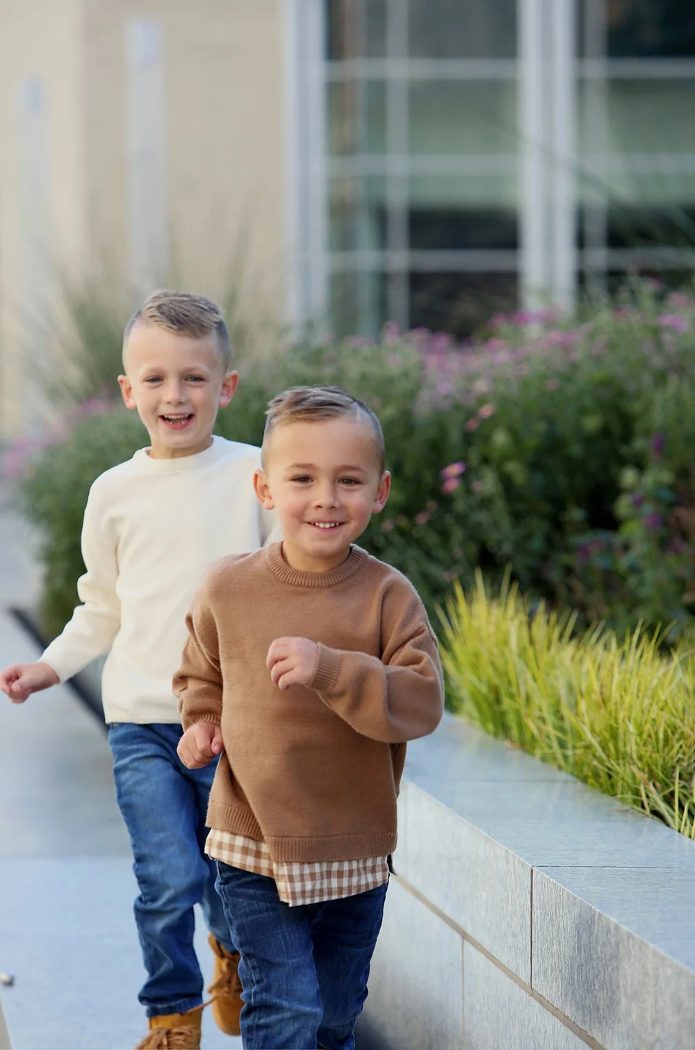 family portrait of two boys running by Rachel Garrison