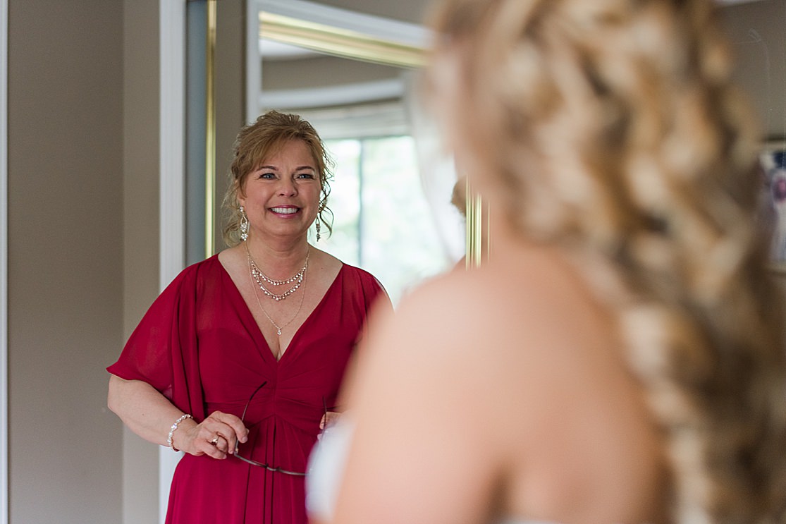 brides mum sees her in wedding dress bridesmaids getting ready taken by west midlands wedding photographer Lisa Lander
