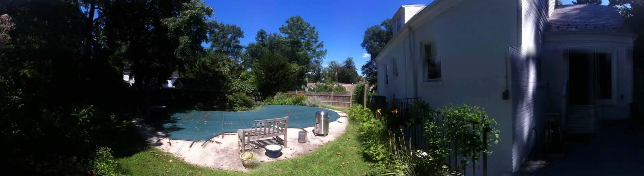 Pre-demolition and construction - 2013. Property area pool was removed and cramped basement entrance stairway was reversed. New stair alignment and terraced grade provided improved basement views / natural lighting, as well as more direct access to new off-street parking @ new fence & gate alignment.