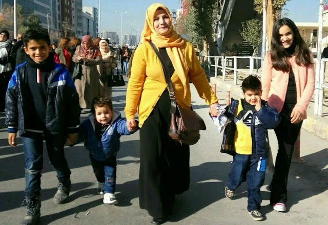 Sazgar and her children marching in the city of Sulaimani. Photo by: CPTers