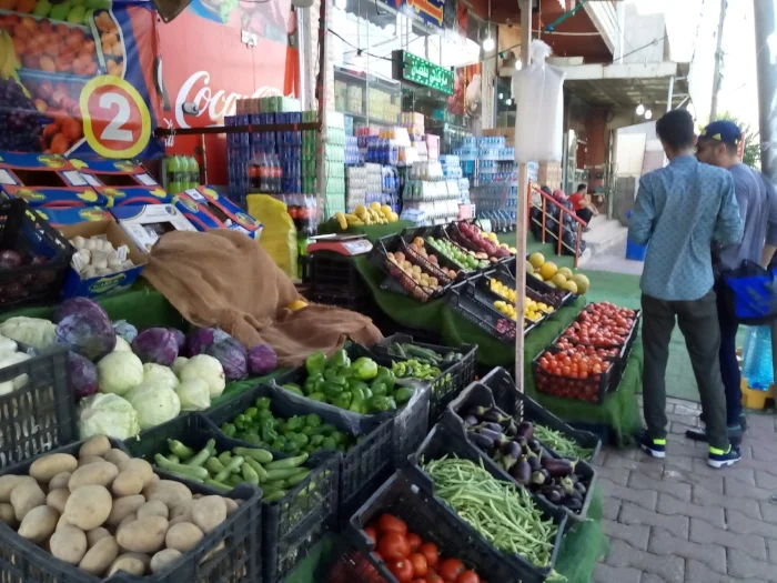 People buying fruit and vegetables for Eid.