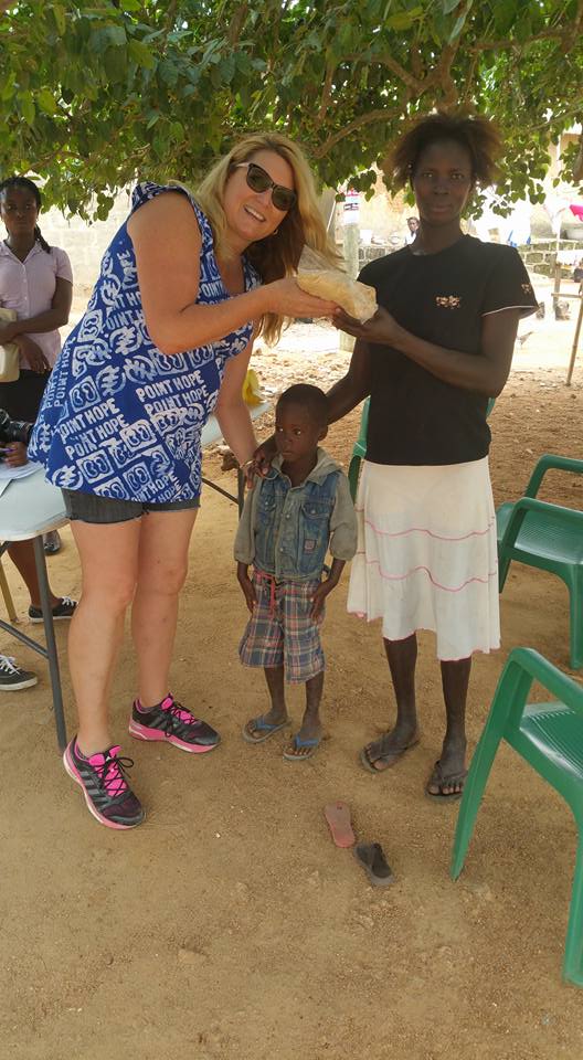 Mama Delilah distributes porridge