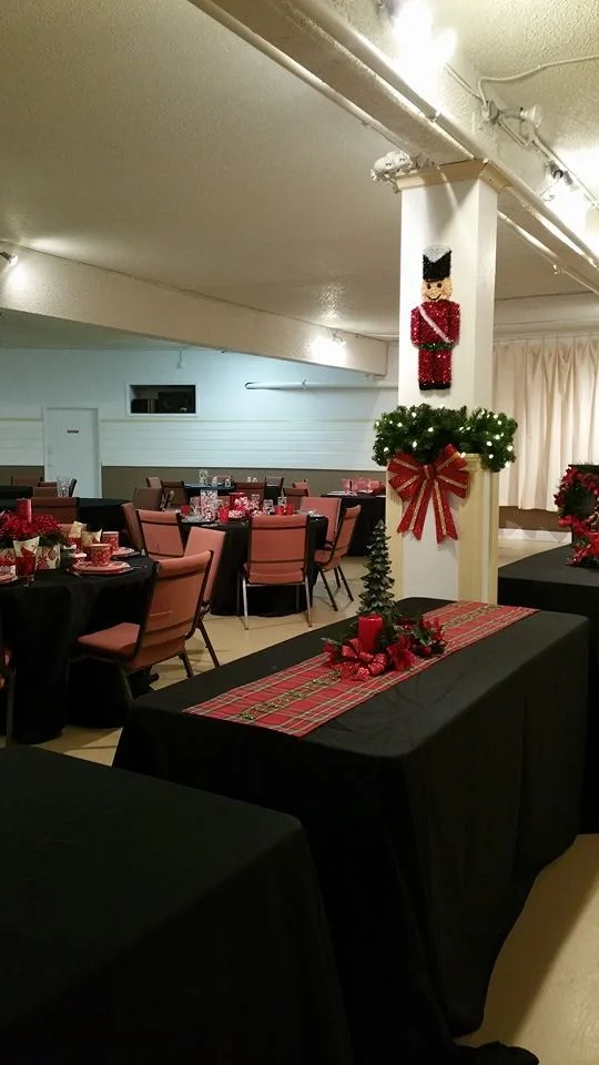 Tables are set with festive decorations.jpg