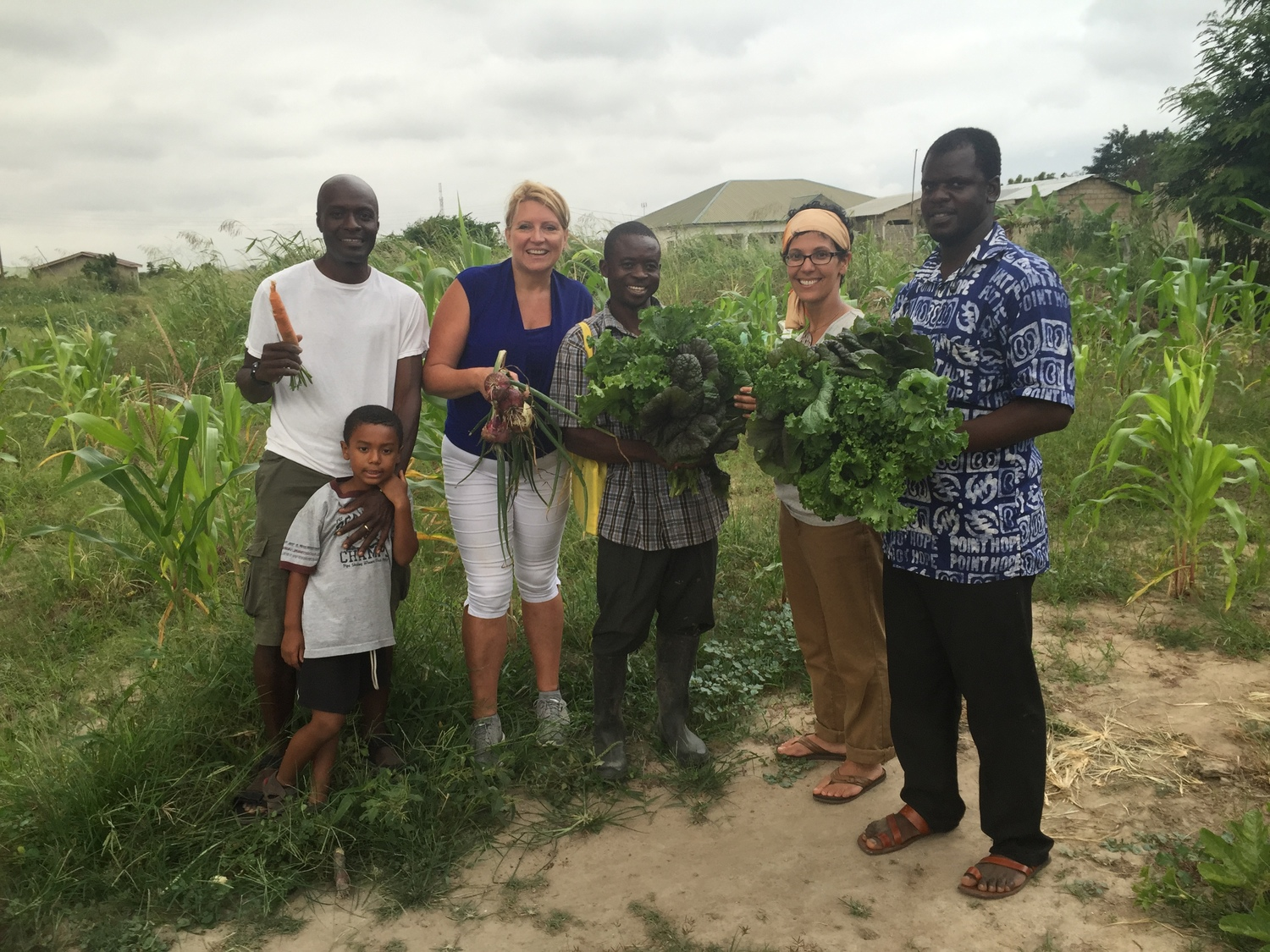 A group harvest with visitors.png