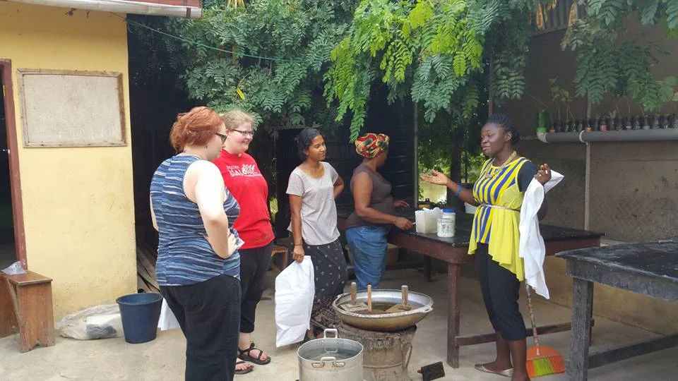 Ida instructs volunteers in the art of batik fabric creation on a day off. They took home the fabric art they created.