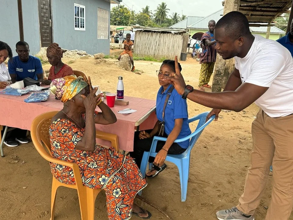 Amoanda Community Dr Poku and lady.jpg