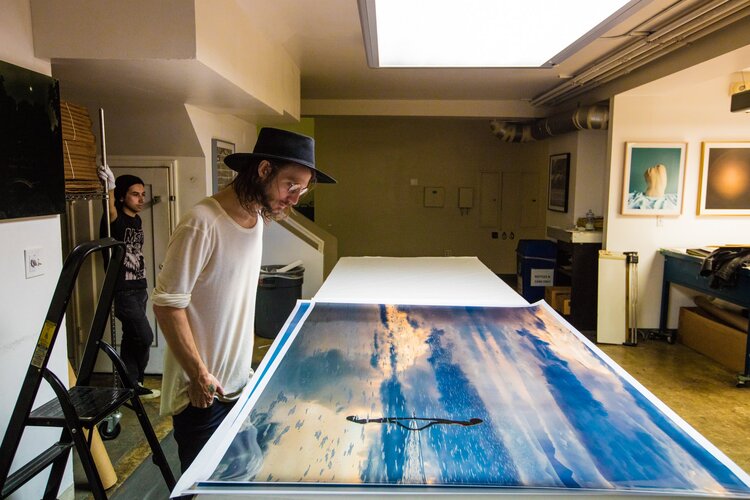 Clayton doing the final overlook of his photograph "Dream Walker" before shipping to a collector in Tulum, Mexico. The Icon, Los Angeles, 2017