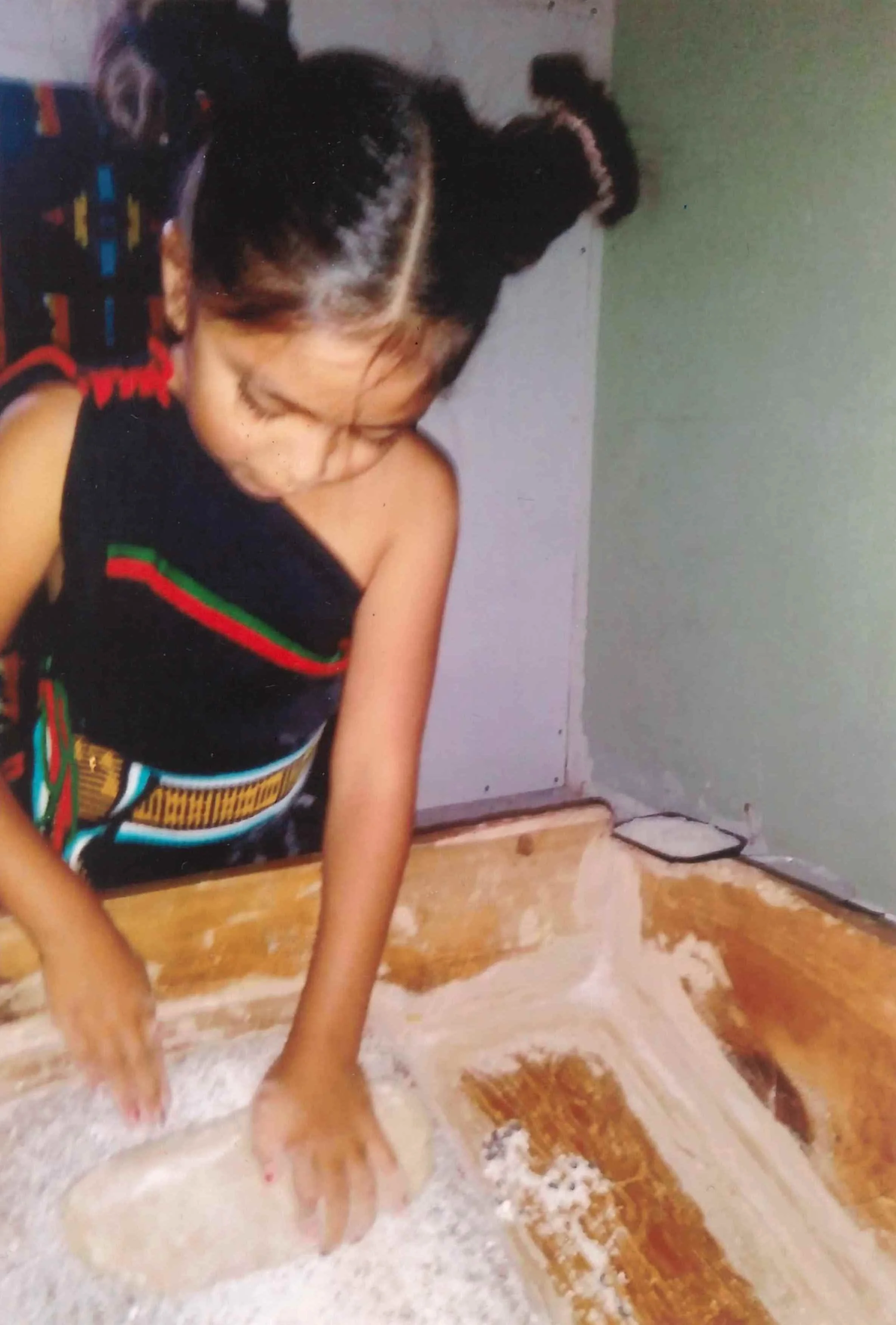Photo8_Young girl in training for corn grinding ceremony.jpeg