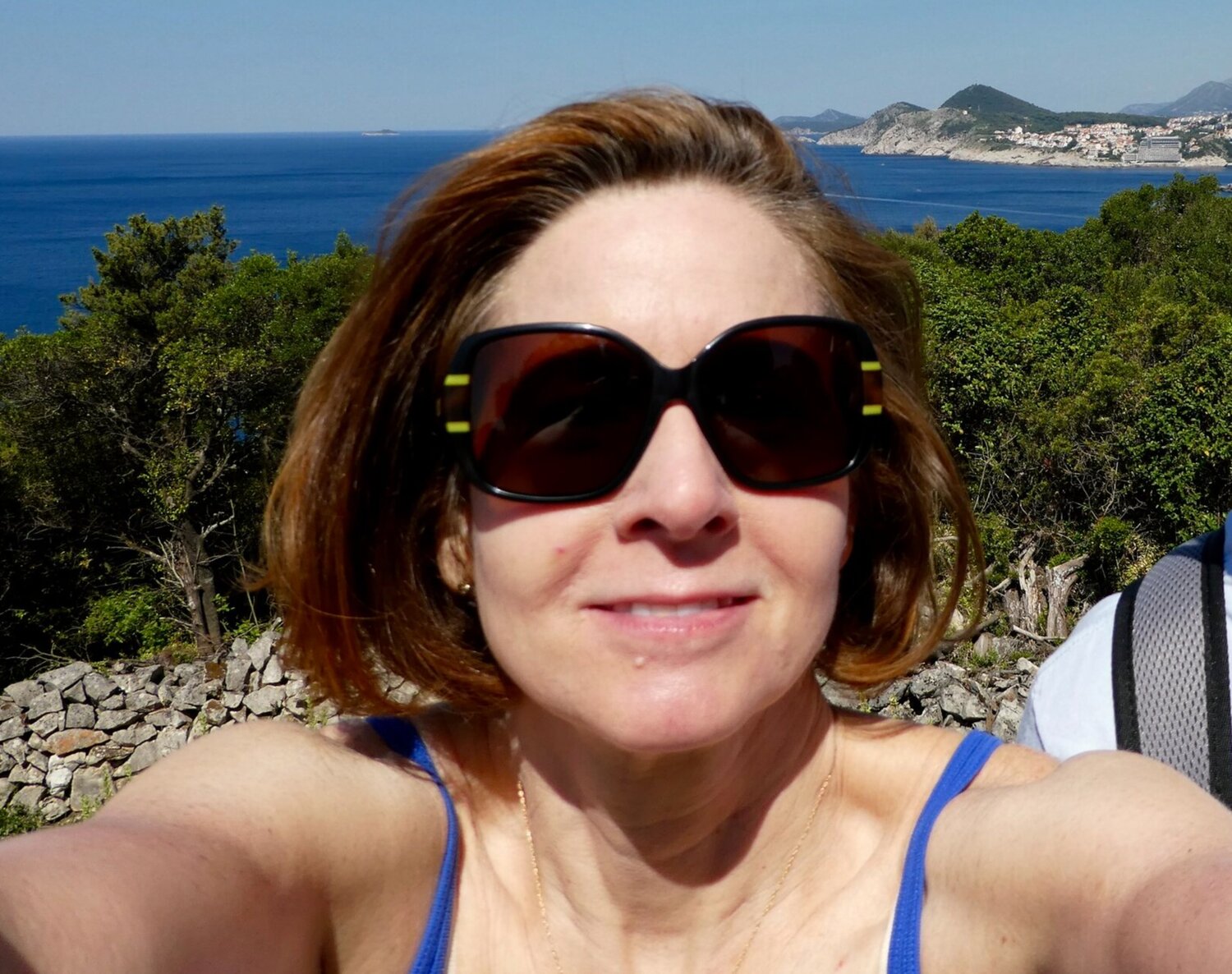 Me, on a pre-pandemic trip to Croatia, riding a bike for the first time in 20 years up and down steep, windy hills. The gorgeous views were worth the effort!