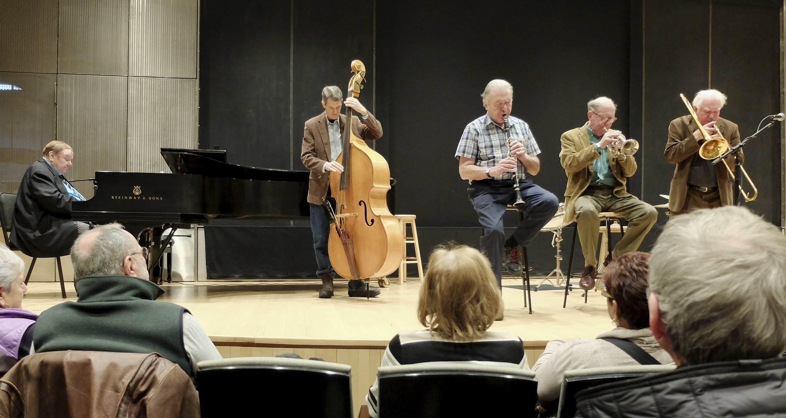 The coronet player (middle) is Lee Lorenz.  He supports his jazz habit as a New Yorker cartoonist and its former Art Editor.