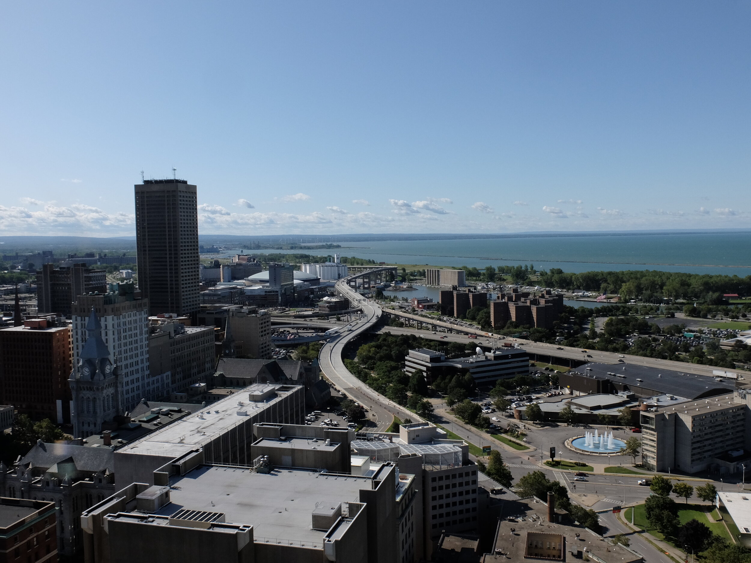 The white grain elevators are General Mills. When Cheerios are made, Buffalo smells like them.  In front of them is the terminus of the Erie Canal. 