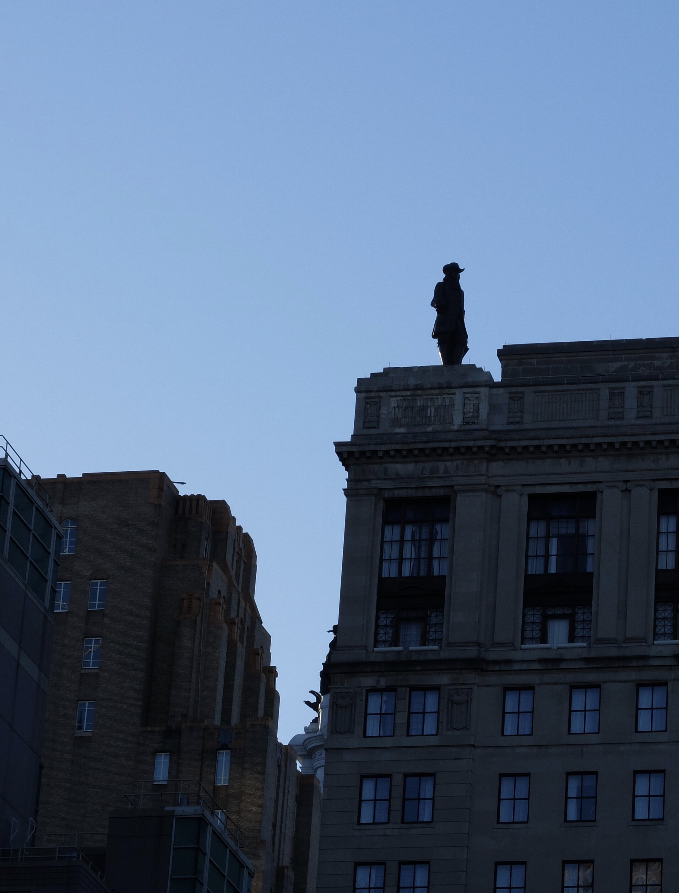 Seen from afar, Calder's 1894 bronze statue of Wm. Penn atop City Hall.