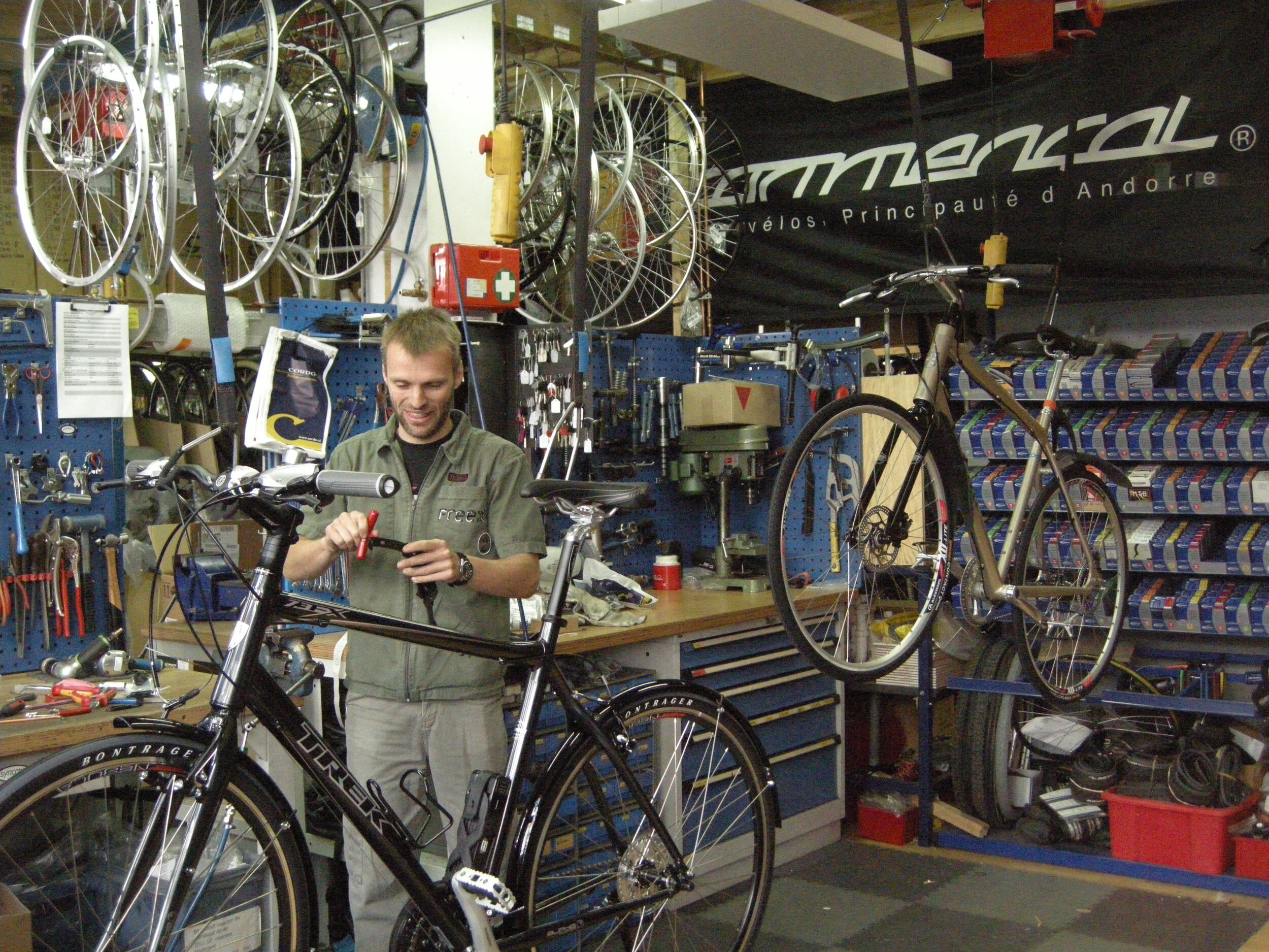  I think in Haarlem, NL, this mechanic took a look at the lubricant than had been oozing out of my bike's headset for days.   
