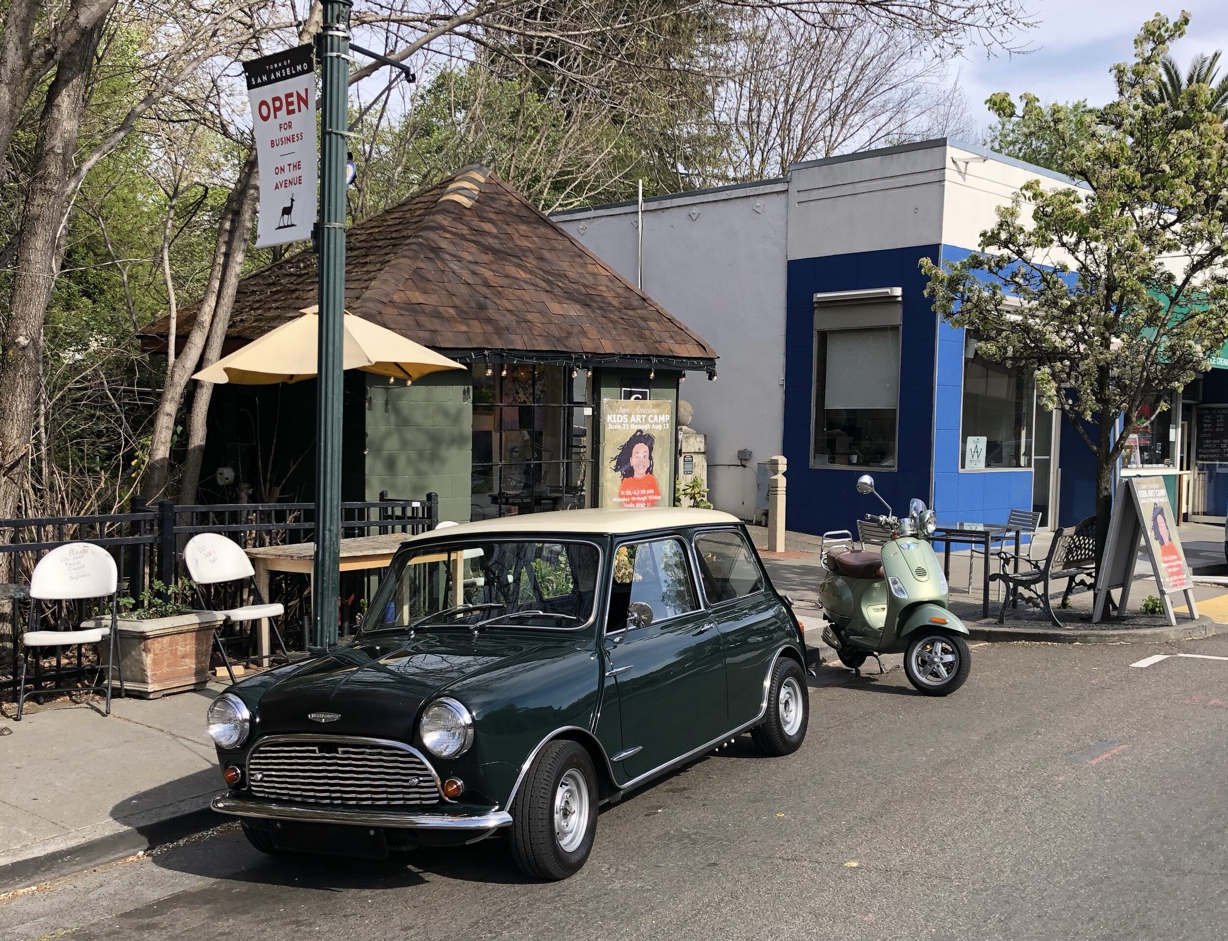 Our VESPA cozying up to an A+ looking restored AUSTIN COOPER Mini in downtown San Anselmo.