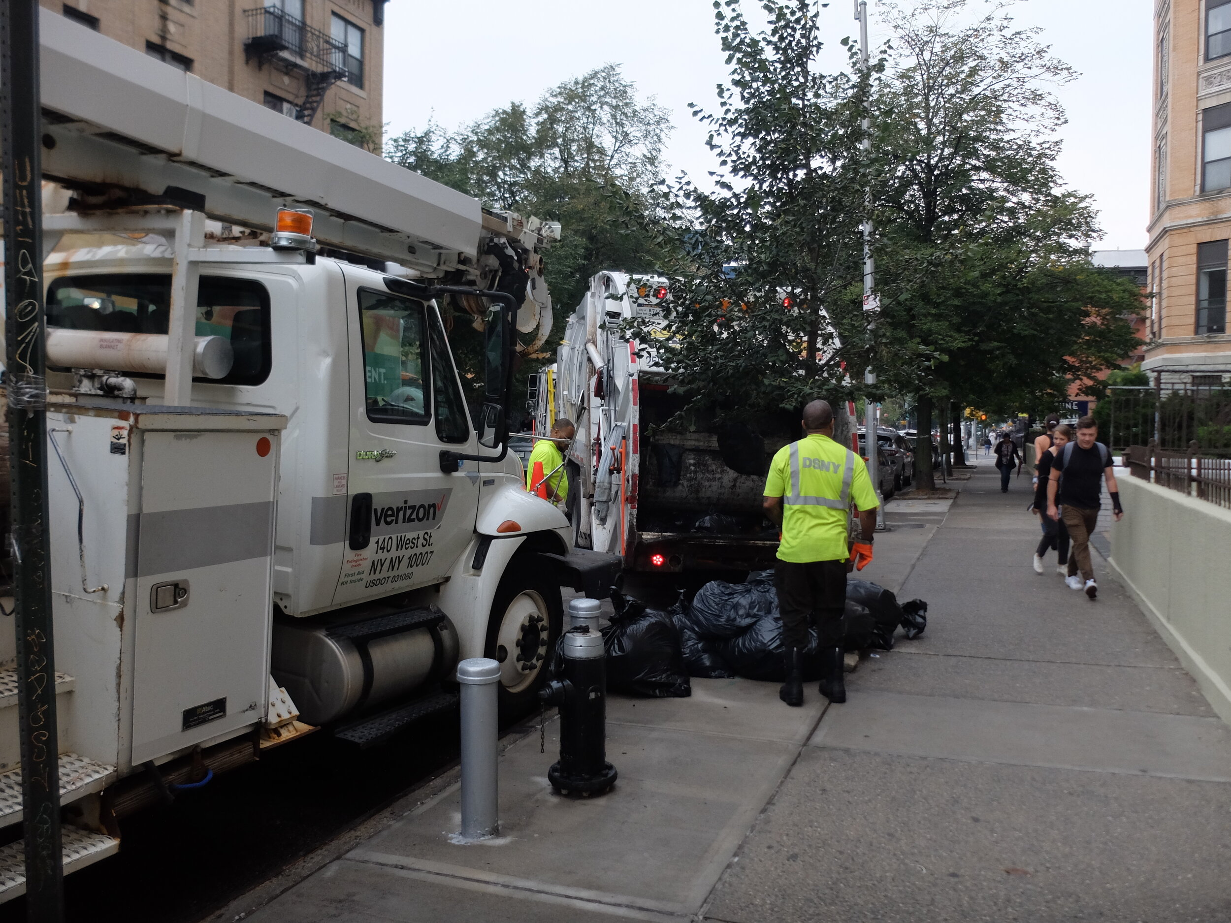 This Dept. of Sanitation worker apologized to the line of cars they had held up.  We've encountered a lot of polite folks here.