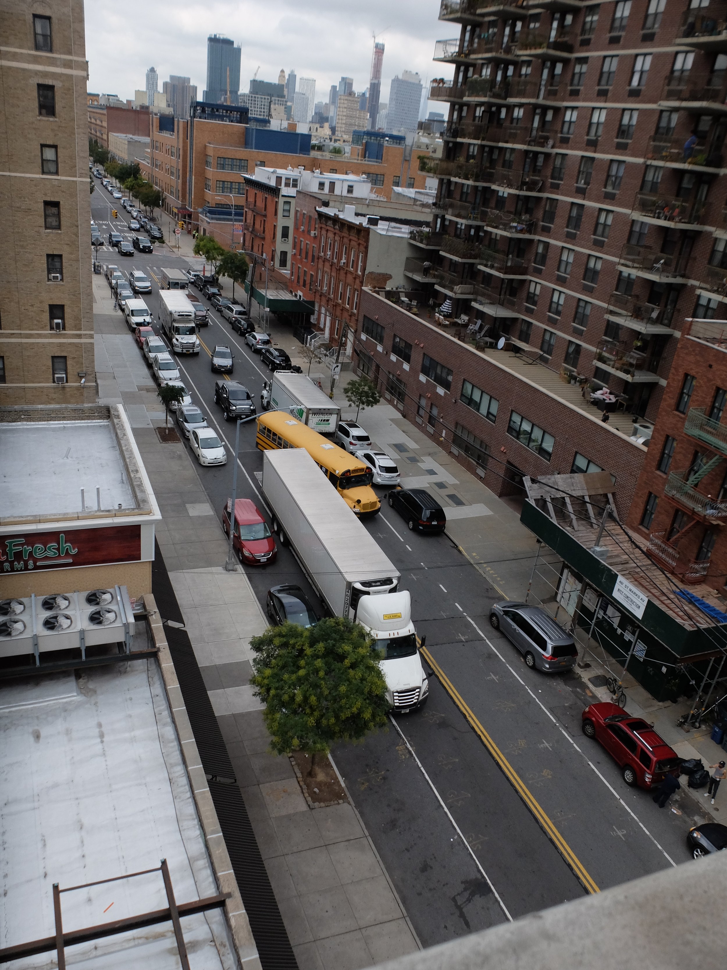  I had heard  honking for a long time &amp; finally looked out.  The truck on the upper right could have moved just a little bit to allow the school bus easy passage &amp; avoid the traffic jam &amp; continuous honking.  Inconsiderate.  Another examp