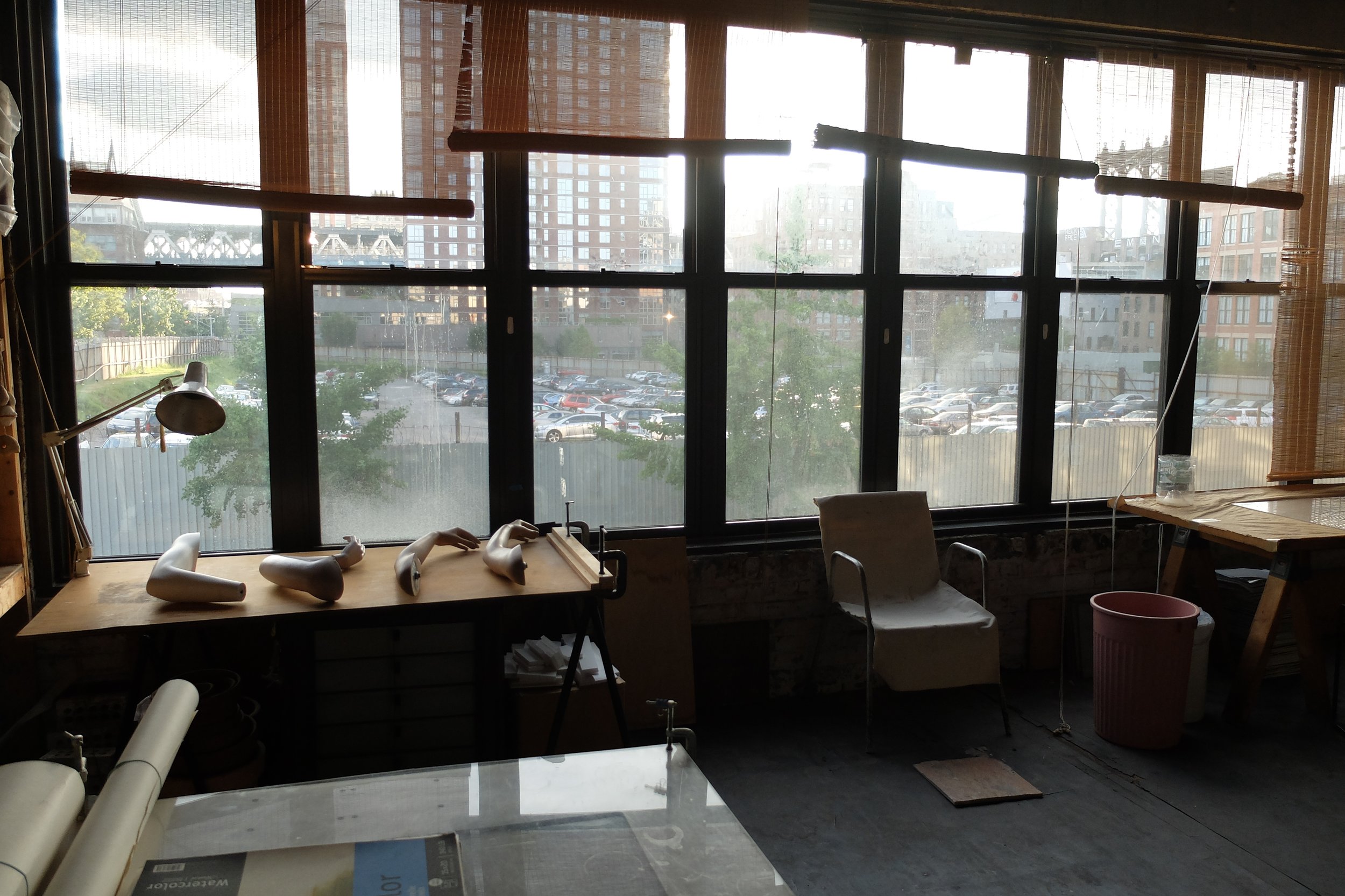 View (c. July 2013), from Nate's former art studio, of the parking lot that is now filled by a huge building. 