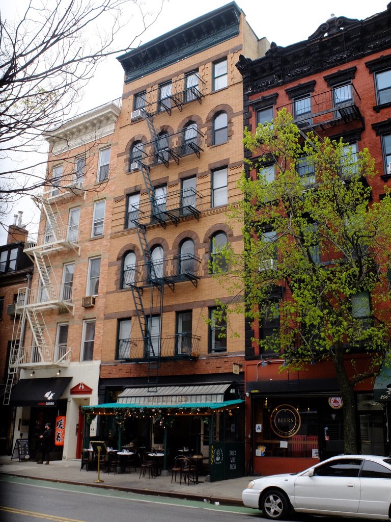  Ted lived on the 6th floor of this tan, with arched windows, walk-up, building.  A neighbor had lived here all her life.  She told Ted that there was gas lighting until 1950. Her parents wanted a t.v. &amp; asked the landlord to convert to electrici