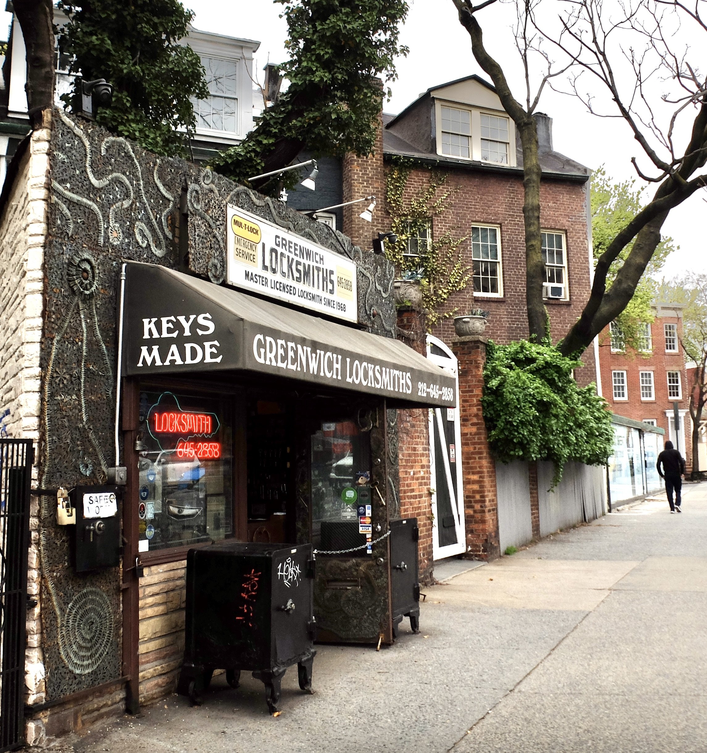  Phil Mortillaro’s Greenwich Locksmiths is reputed to be the smallest freestanding building in Manhattan.  The house next to it must date from the time of people arriving mounted on a horse.  Check out the height of the gate. 