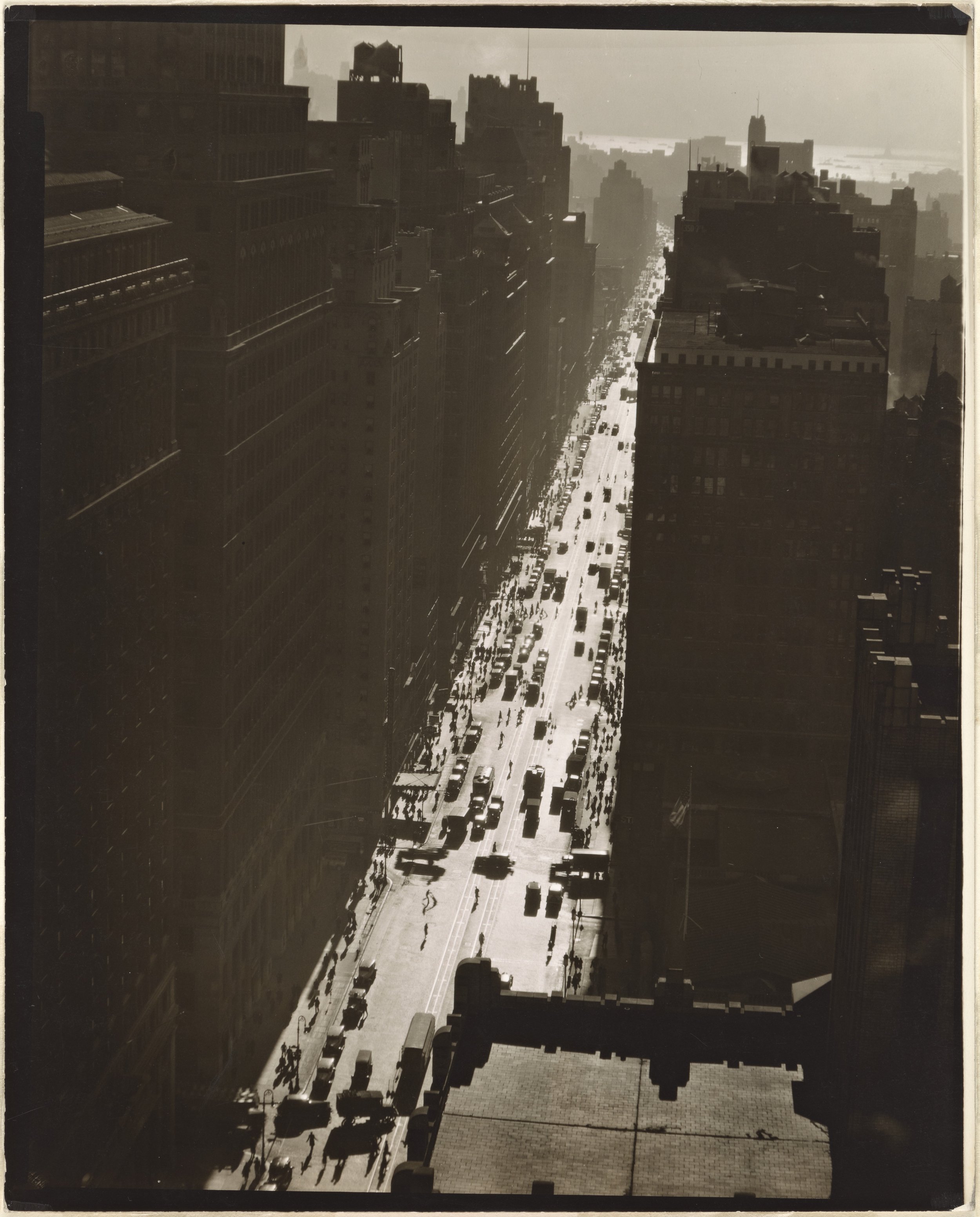 The upper part of this 1935 photo of 7th Ave. by Berenice Abbott shows the angle where 7th Ave. South begins. 