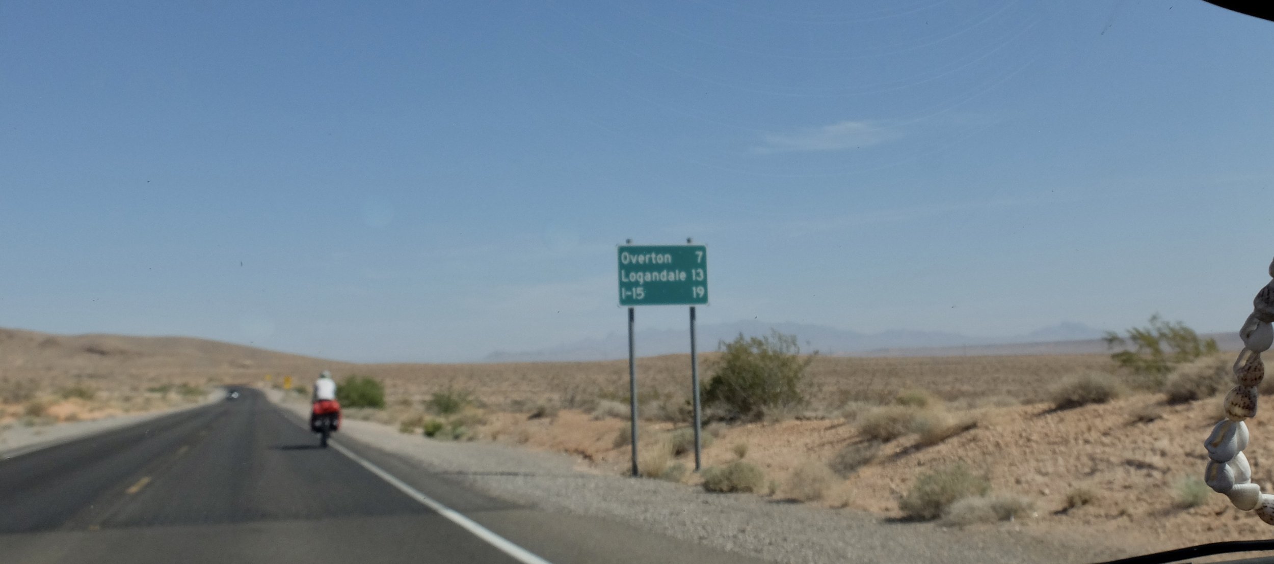 On the road to Springdale, UT &amp; Zion Nat'l Park.  It was over 90 deg. with wind.  Crazee loaded bicycle tourer!