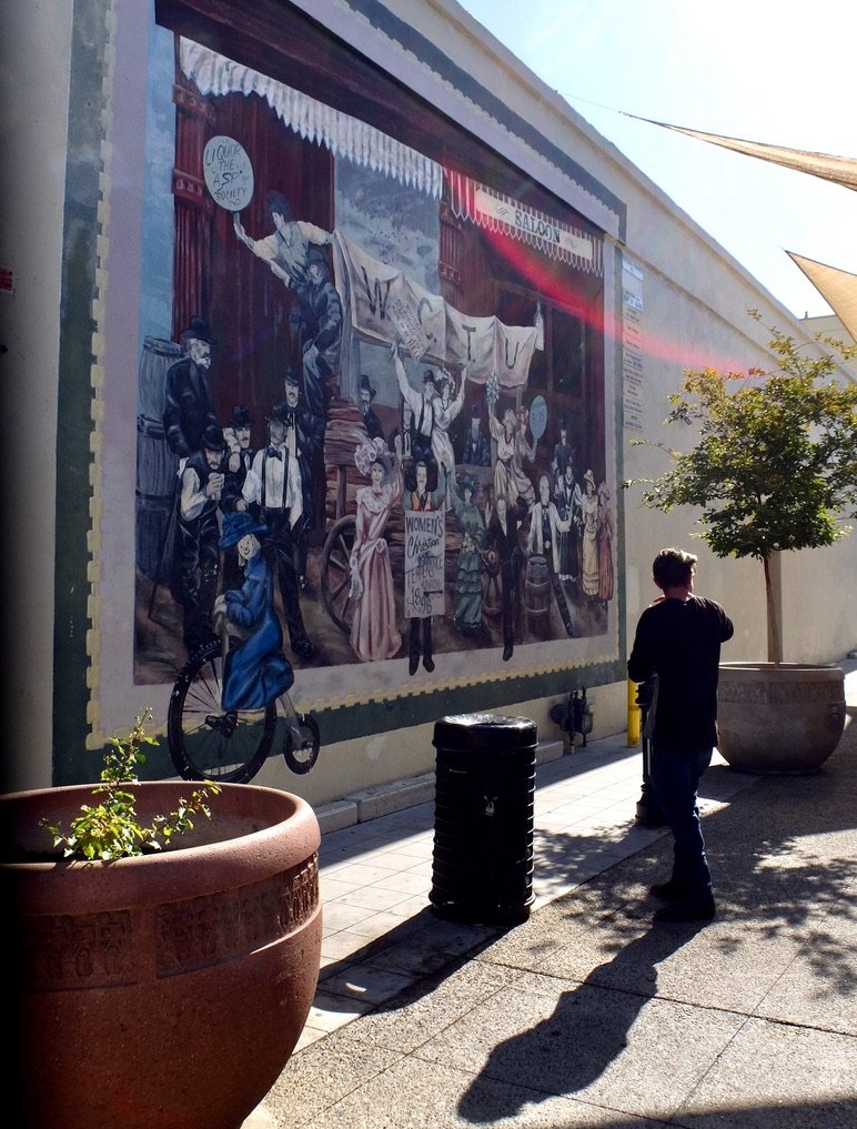 On Wall St. a mural depicting the Woman's Christian Temperance Union.