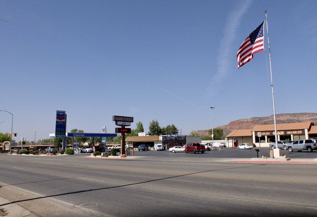  We stopped for gas at the Chevron station.  Squeegees in excellent condition, clean water, &amp; plentiful paper towels to clean Miles' windshield, laughable bathroom signage, excellent people watching &amp; petrol for less than $6-/gallon. 