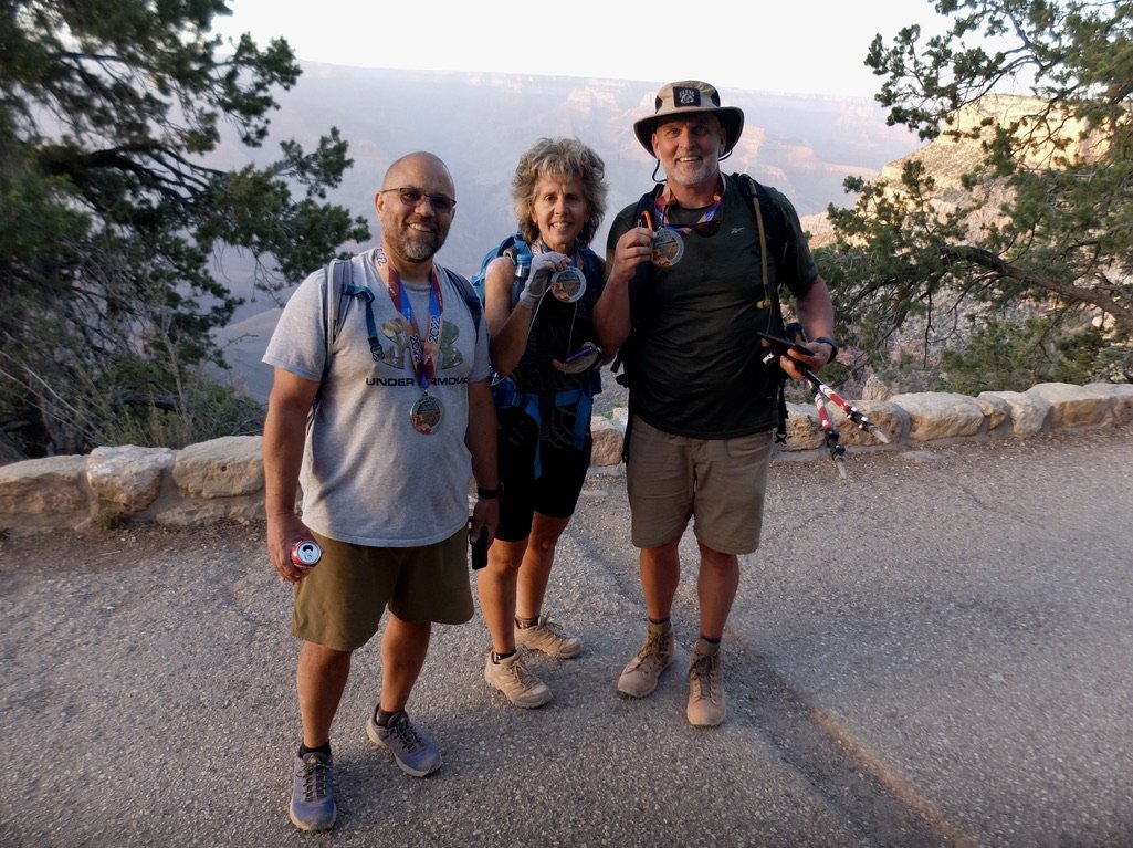 We had heard a lot of hootin' &amp; a hollerin' coming from the Bright Angel Trailhead.  People were celebrating completing the rim to rim walk.  These three had started out that morning.