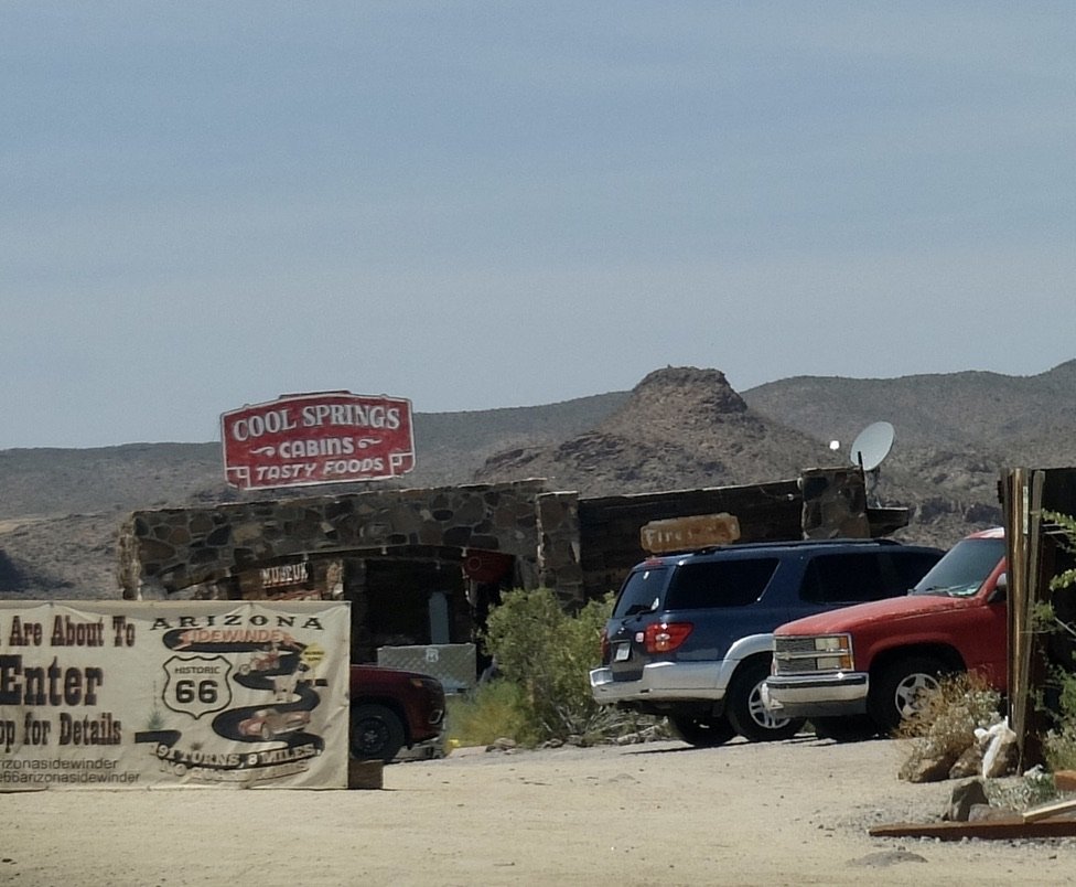 I was intrigued by this sign &amp; the scene.  Lucky for Nomi that I didn't know what the interior held.   From their website: https://www.route66coolspringsaz.com//  “The New Cool Springs Sign is an exact replica of the vintage sign. 	      	   	  
