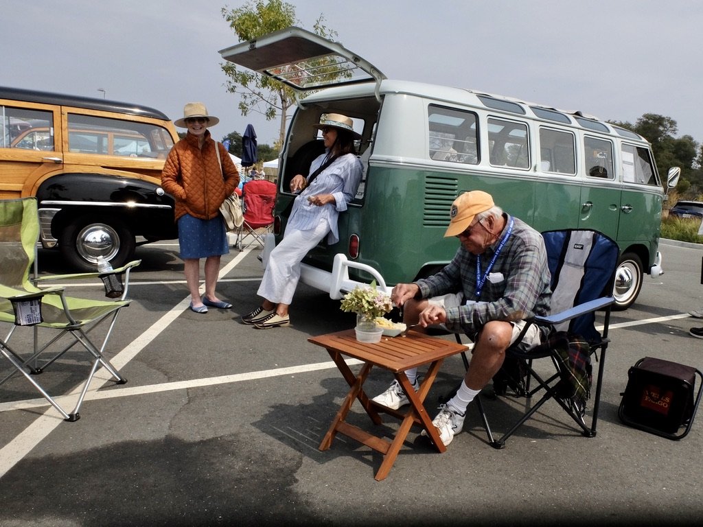 This couple still travels around in this original &amp; gorgeously maintained 21 window VW micro bus.