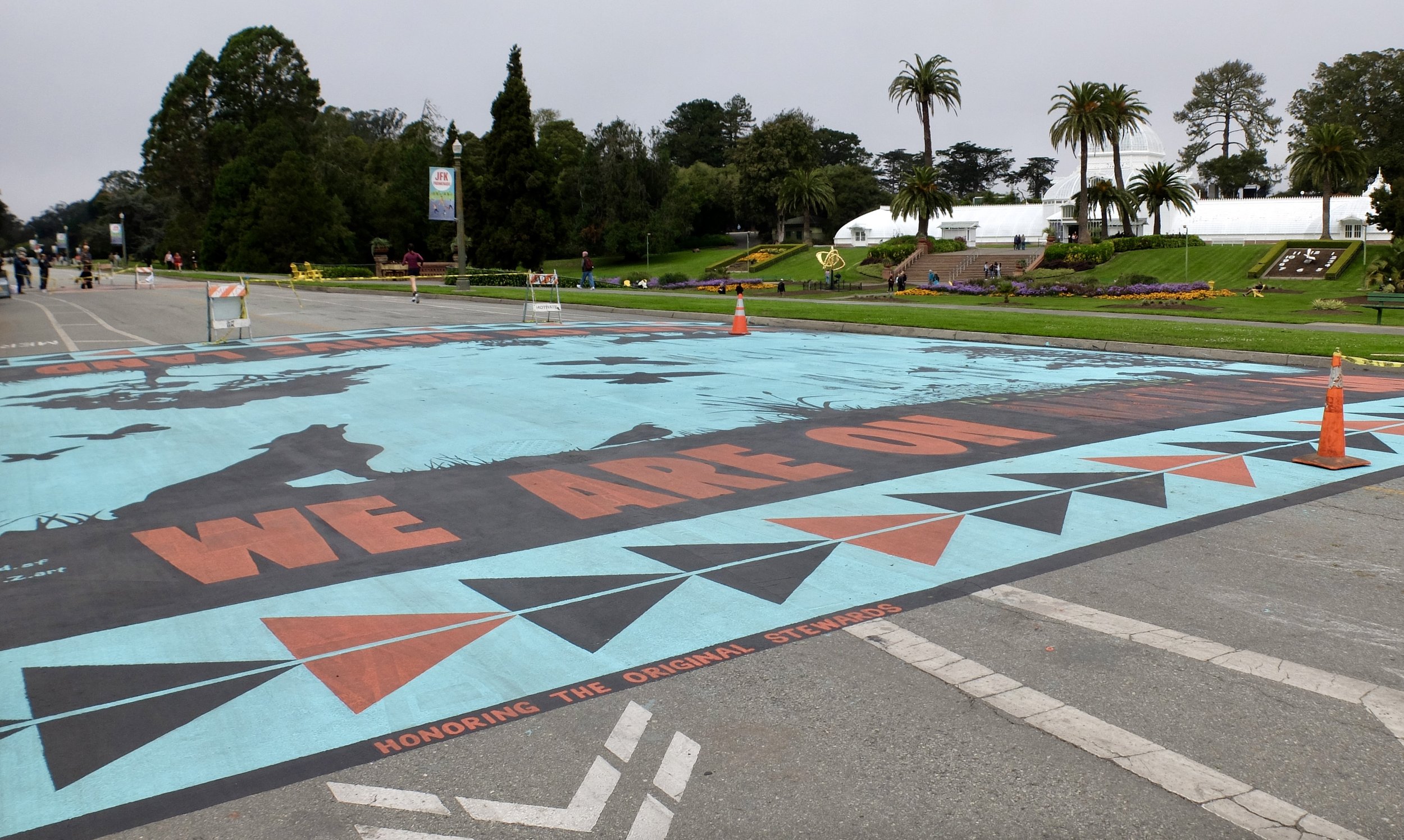   We Are On Native Land    “For  Indigenous Peoples Day,  American Indian Cultural District in partnership with Illuminate, Paint the Void, and artist Rachel Znerold invited the community to join together for a poignant mural painting on JFK Drive in